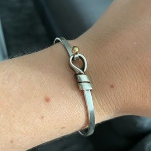 Tiffany’s silver and 18k gold hook/knot bangle